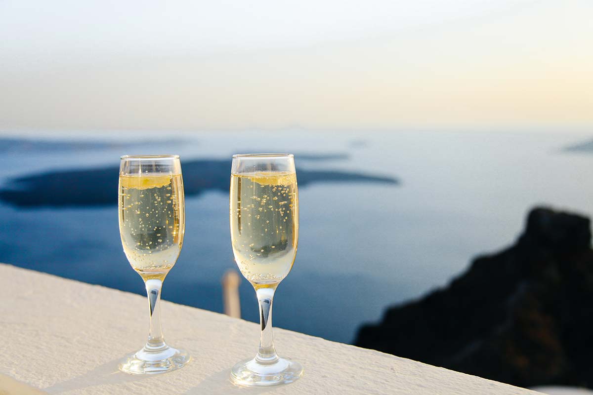 two-glasses-of-champagne-overlooking-the-water-ready-to-experience-luxury | nyc concierge services by the personal helpers