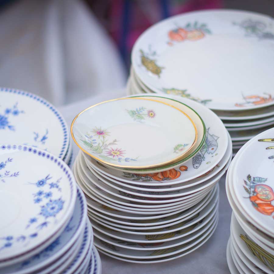 declutter-old-china-plates-in-stacks-being-packed-and-moved