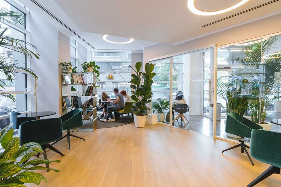large declutterd office modern tech workspace team meeting