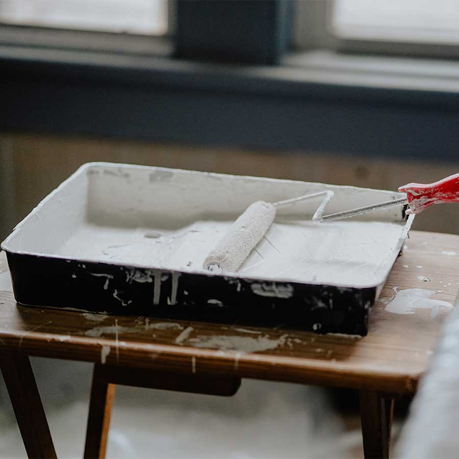 white-paint-in-a-tray-with-roller-for-the-walls