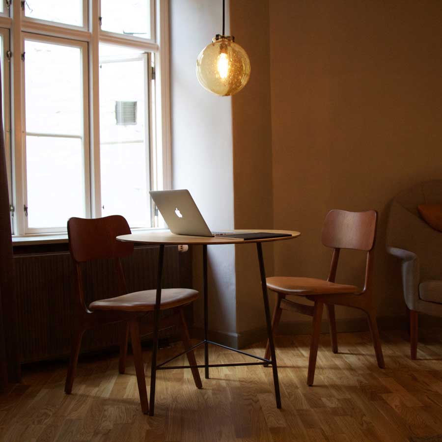 home-workspace-minimalist-brown-table-chairs-macbook