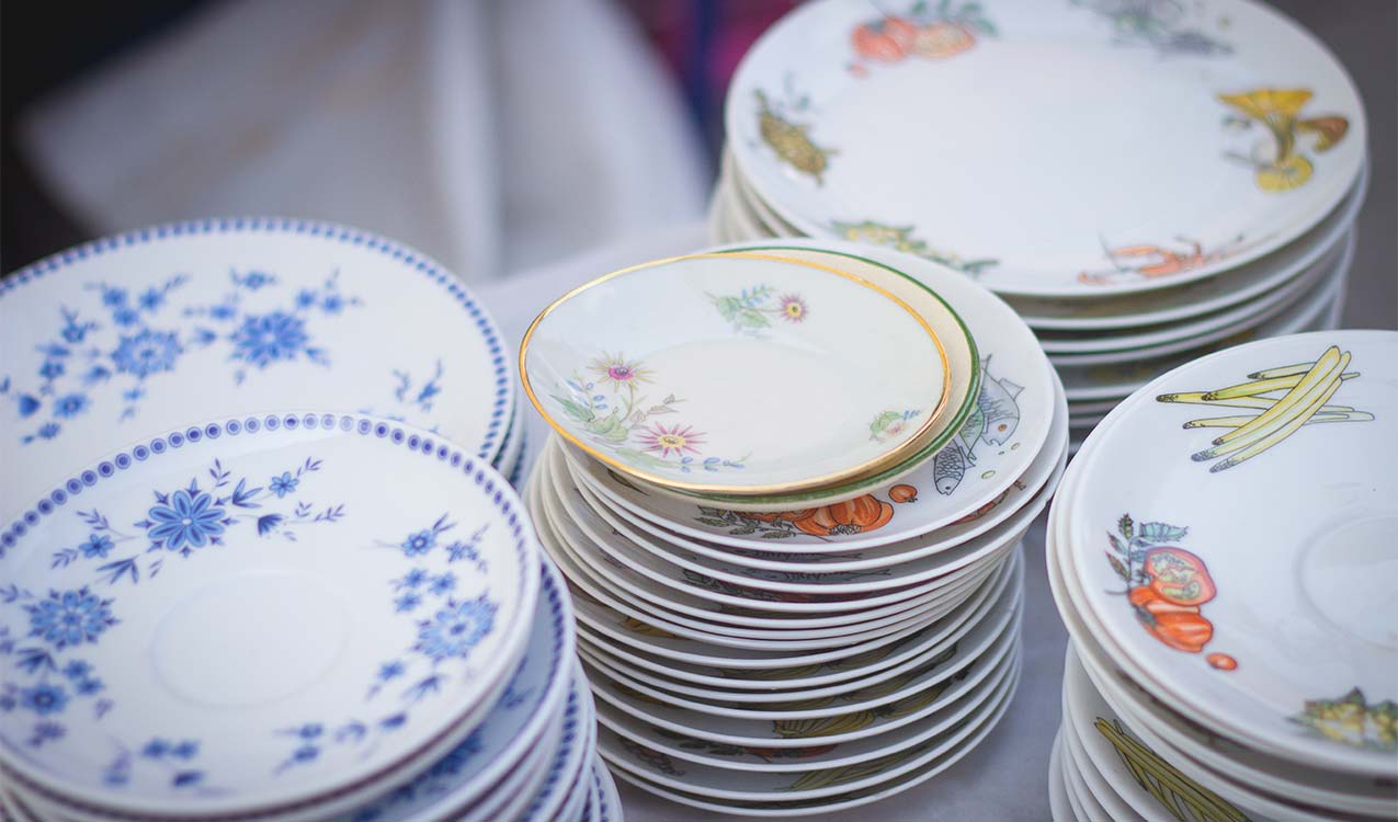 old-china-plates-in-stacks-being-packed-and-moved | The Personal Helpers