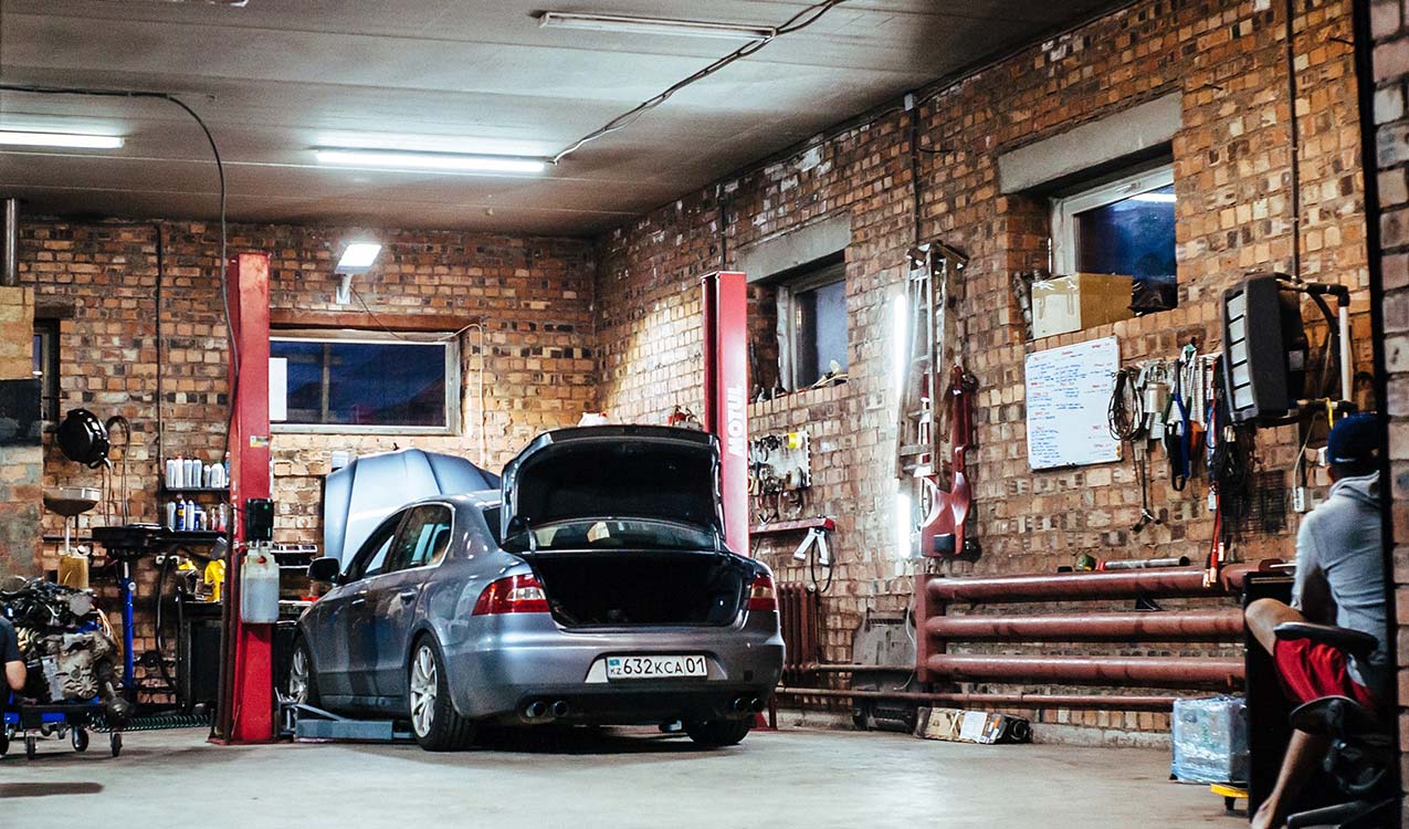 work-garage-interior-with-car-repair-in-progress | The Personal Helpers