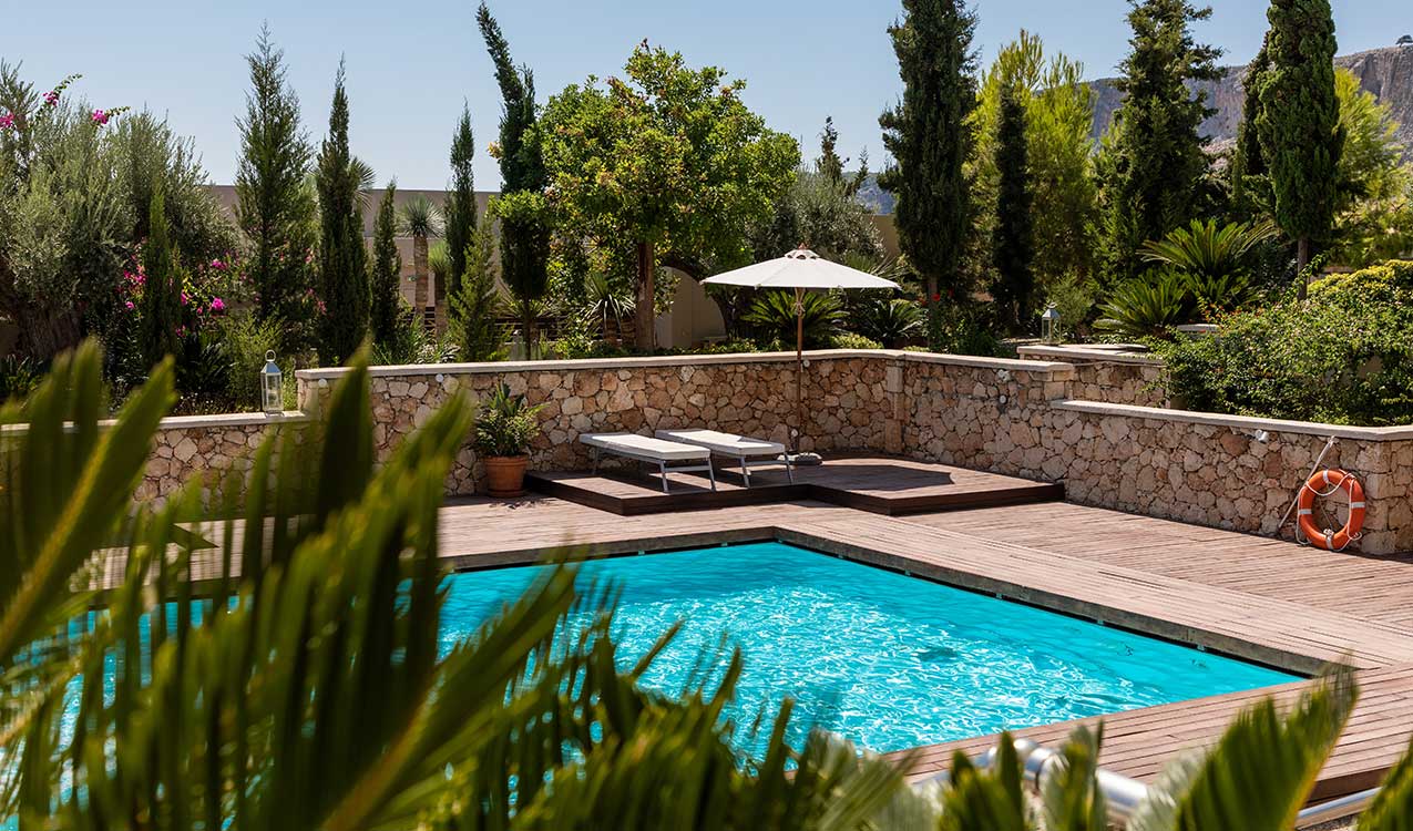 poolside-area-of-the-house-beyond-the-bush | The Personal Helpers