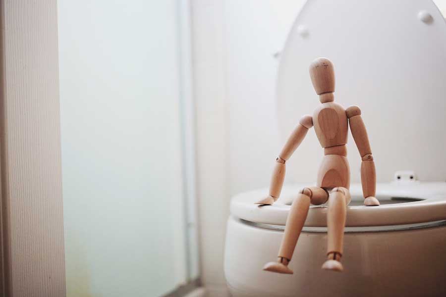 wooden-man-on-clean-toilet
