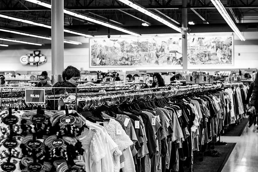 black-and-white-department-store-shirts-on-racks-people-shopping-recycle-old-clothes