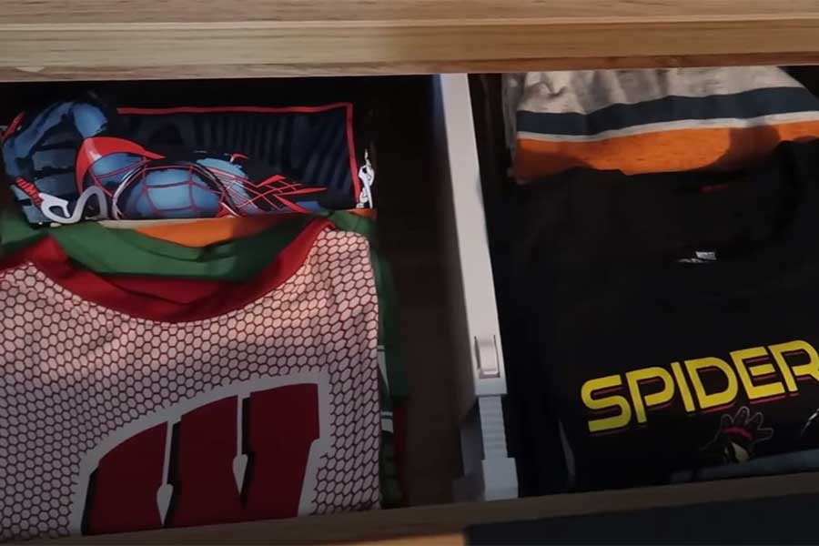 Neatly folded T-shirts in a dresser