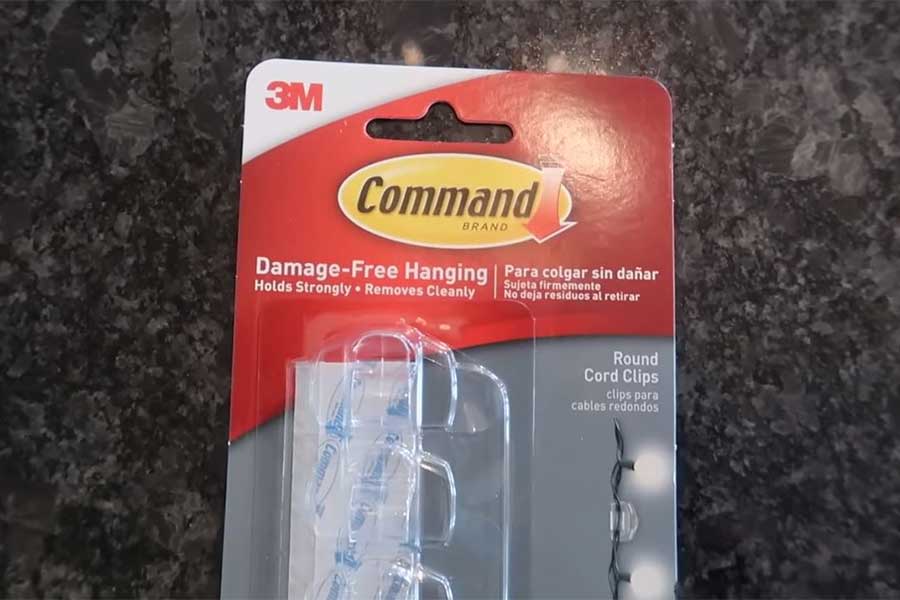 A package of 3M Command hooks for neat wire organization