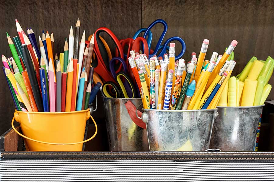 color-pencils-scissors-pens-highlighters-sorted-by-type-in-small-buckets